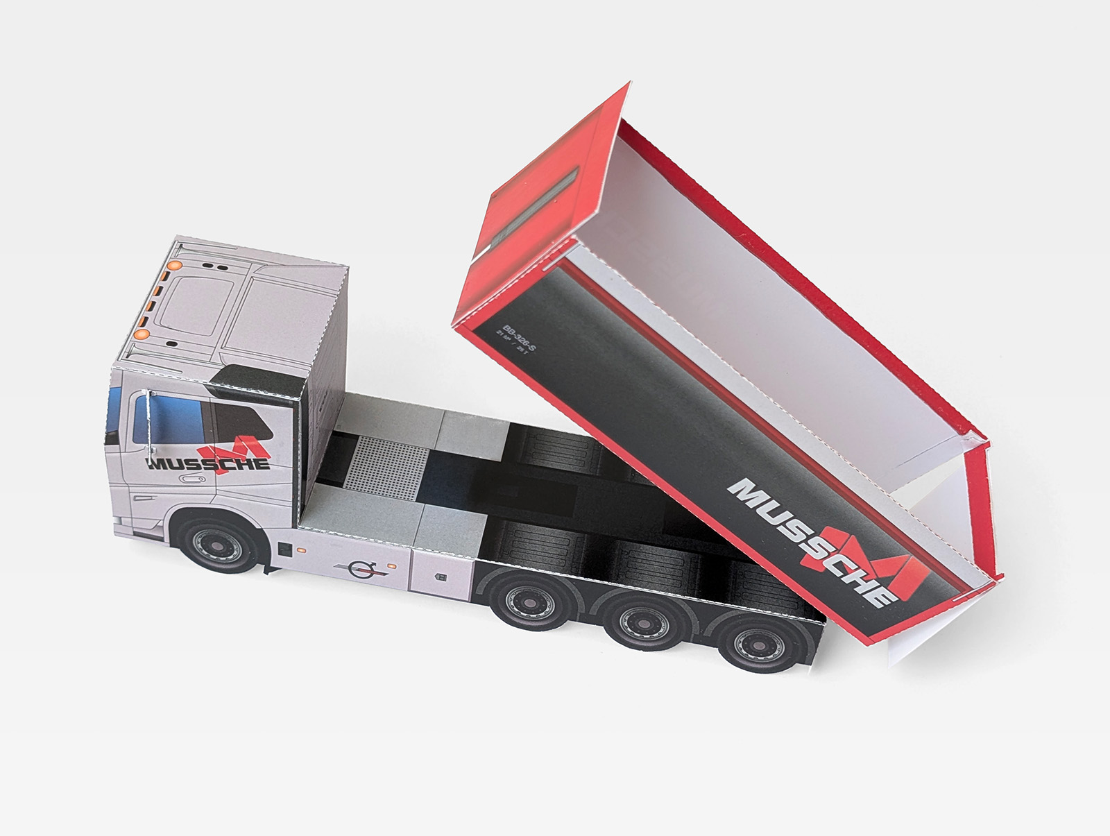 Papieren Volvo truck van Mussche met geopende kipper