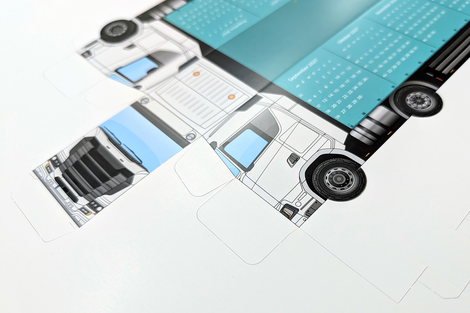 Unfolded die-cut sheet of the paper truck